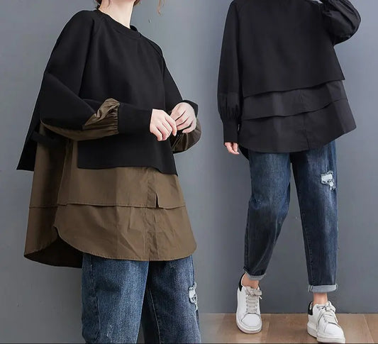 Sweat bicolore oversize noir et blanc, coupe loose ample, effet deux pièces superposées, manches longues froncées