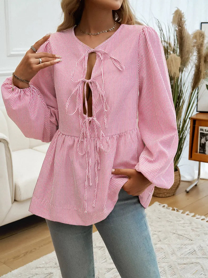 Blouse manches bouffantes avec lacets devant pour ajuster le style