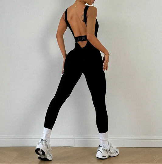 Combinaison de sport noire avec dos nu profond et bande élastique apparente