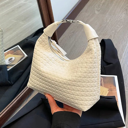 : Sac femme en cuir vegan avec finition tressée chic