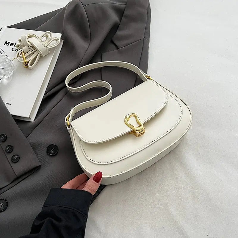 Sac à main blanc carré horizontal, style moderne et raffiné.