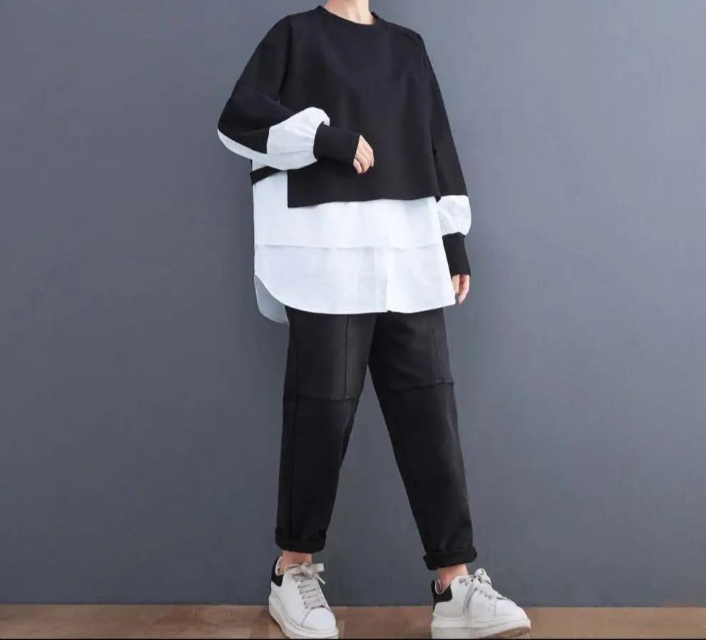 Sweat bicolore oversize noir et taupe, style urbain moderne, coupe loose ample, manches longues, look original