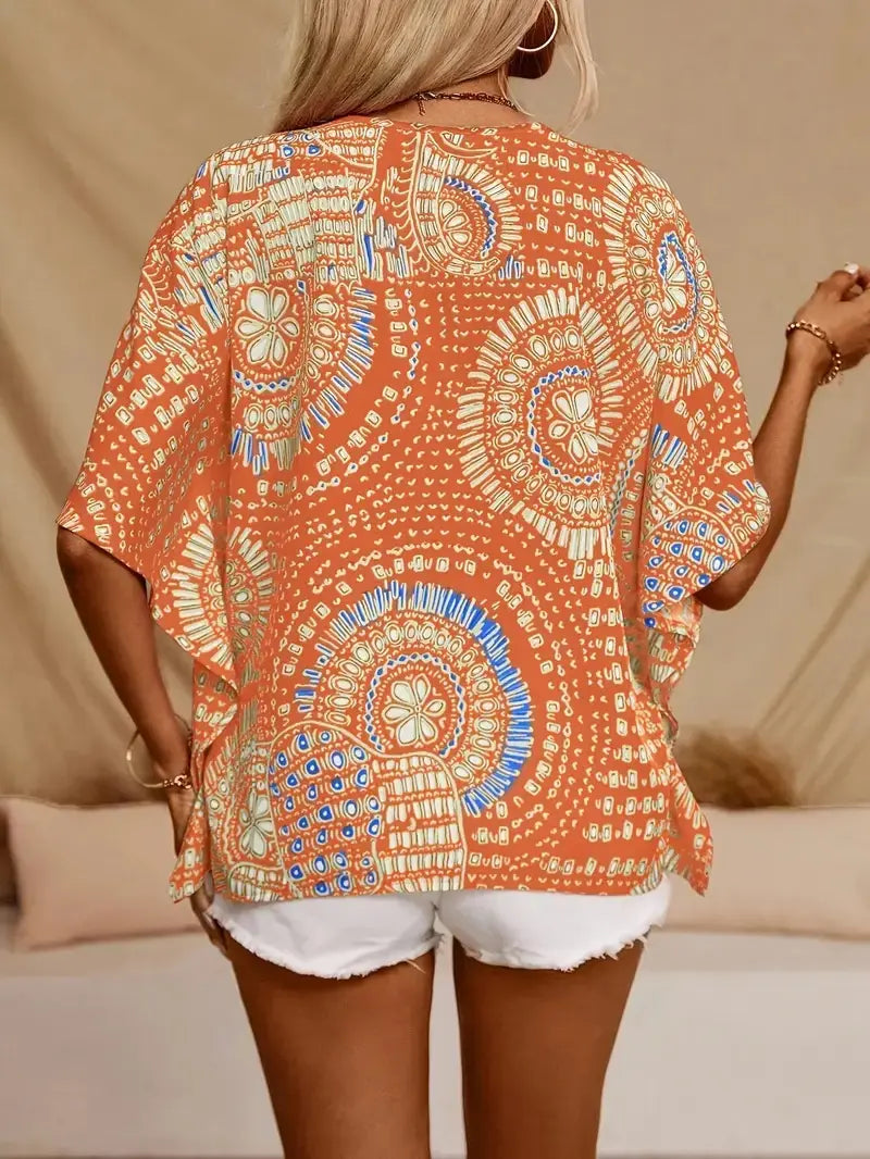 Haut estival féminin fluide, imprimé mandala, style bohème chic, disponible en rouge, vert, noir et orange, tailles S à 2XL.