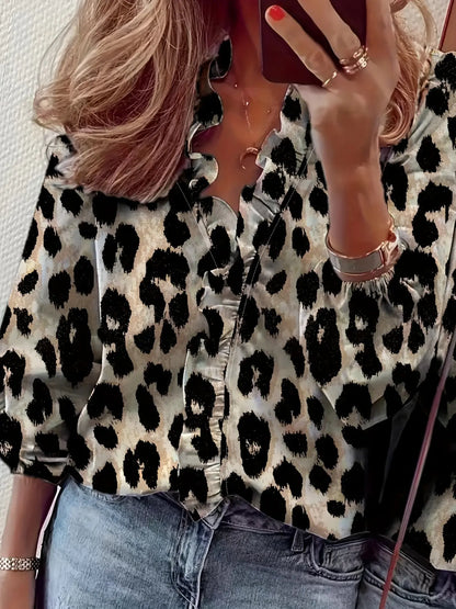 Blouse fluide pour femme, élégante et confortable, manches longues avec poignets élastiqués, volants raffinés sur le col V et le buste, parfaite pour un look doux et structuré.