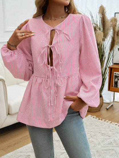 Blouse manches bouffantes avec lacets devant pour ajuster le style