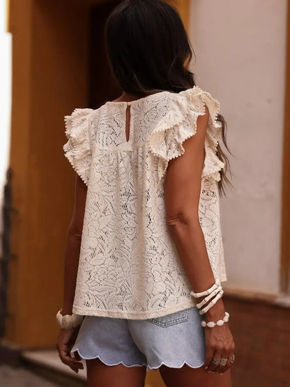 Vue de dos d’une blouse sans manches beige en dentelle à volants