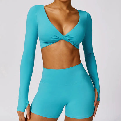 Top de sport bleu croisé en forme papillon, manches longues avec trous pour pouces