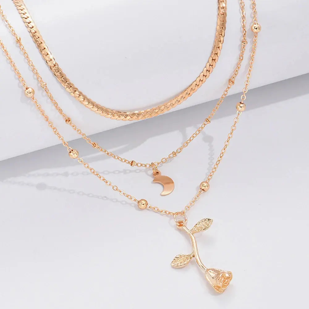 Collier en alliage doré avec pendentifs fleur et lune, parfait pour look chic et élégant