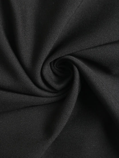 Combinaison femme noire élégante avec ceinture et pantalon fluide SecretBombe