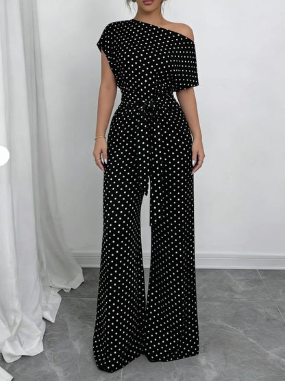 Combinaison femme noire à pois avec taille marquée SecretBombe