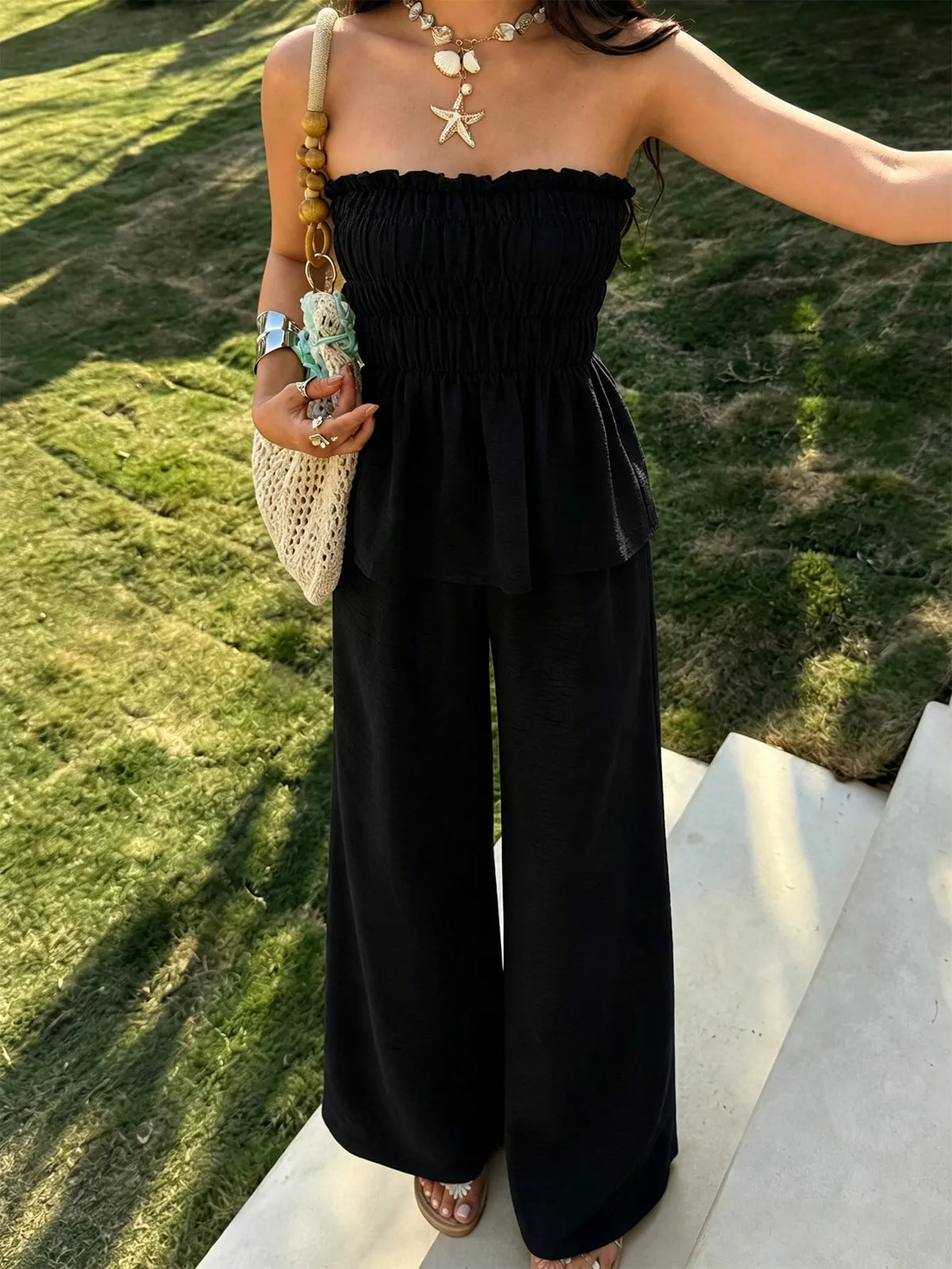 Ensemble deux pièces femme noir avec bustier sans bretelles et pantalon large SecretBombe