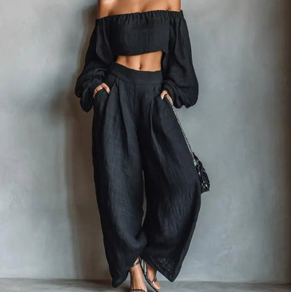 Ensemble femme noir deux pièces avec haut court à épaules dénudées et pantalon large SecretBombe