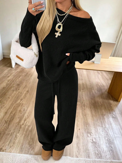 Ensemble femme noir avec haut à épaules dénudées et pantalon large SecretBombe