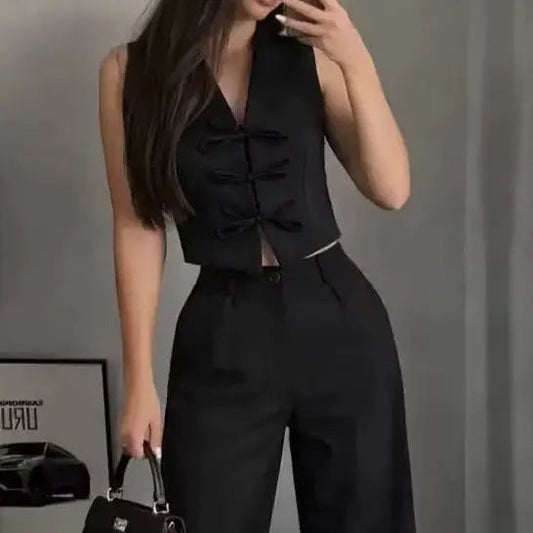 Ensemble deux pièces femme noir avec gilet cintré sans manches et pantalon large taille haute SecretBombe