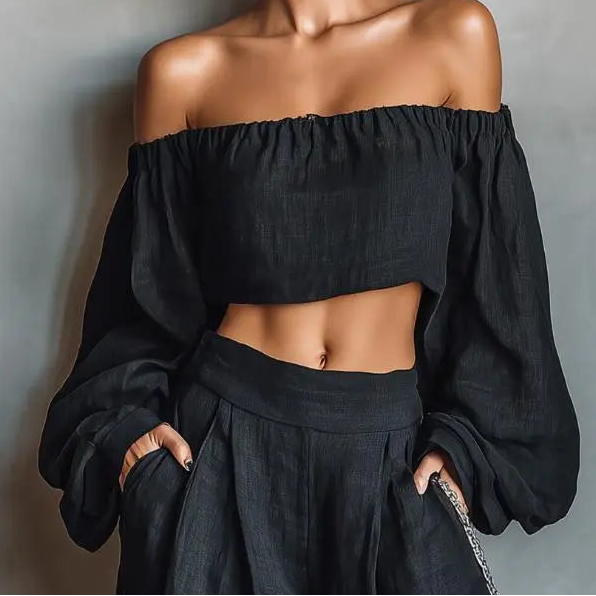 Vue rapprochée de l'ensemble femme noir avec haut court et manches longues bouffantes SecretBombe