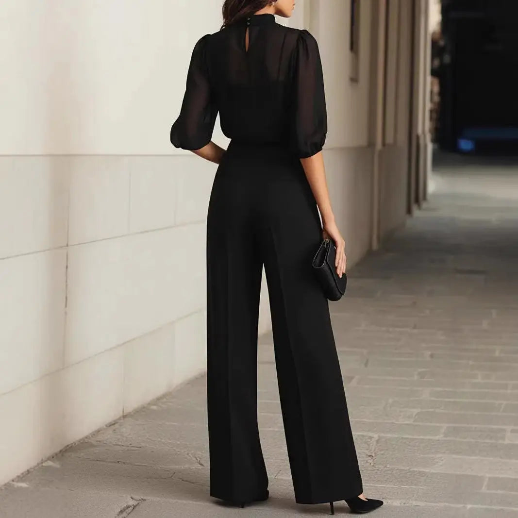 Vue arrière de l'ensemble femme noir avec haut transparent et pantalon large SecretBombe