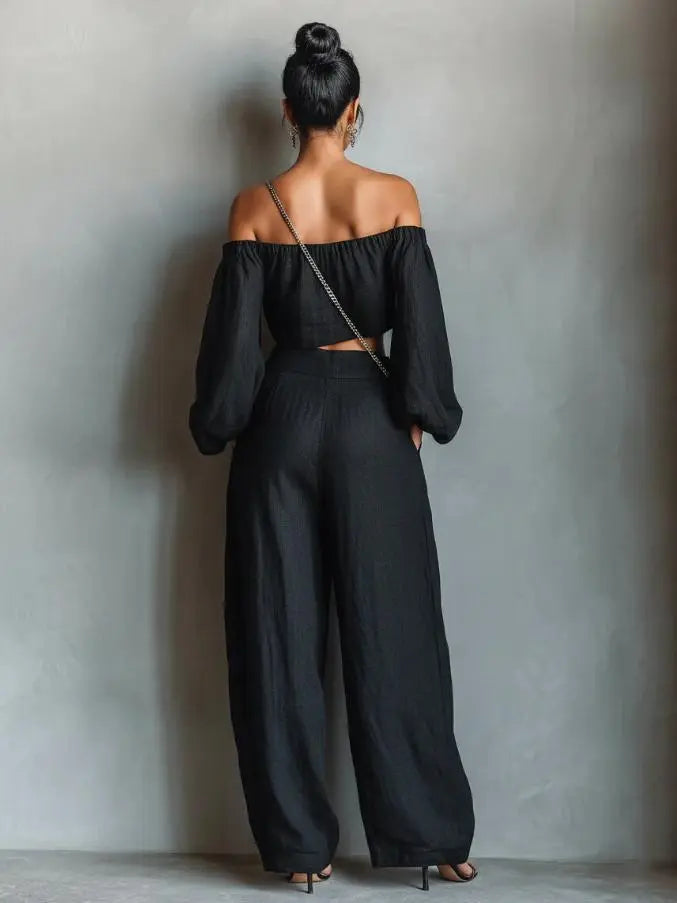 Vue arrière de l'ensemble femme noir à épaules dénudées avec pantalon large SecretBombe
