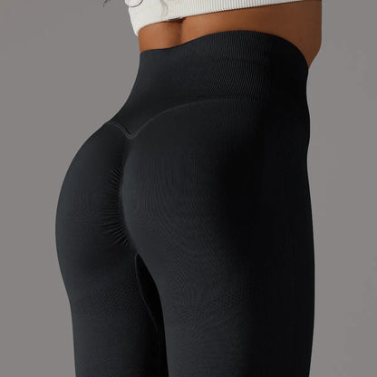 Legging de fitness noir vue de face, coupe ajustée et ceinture amincissante