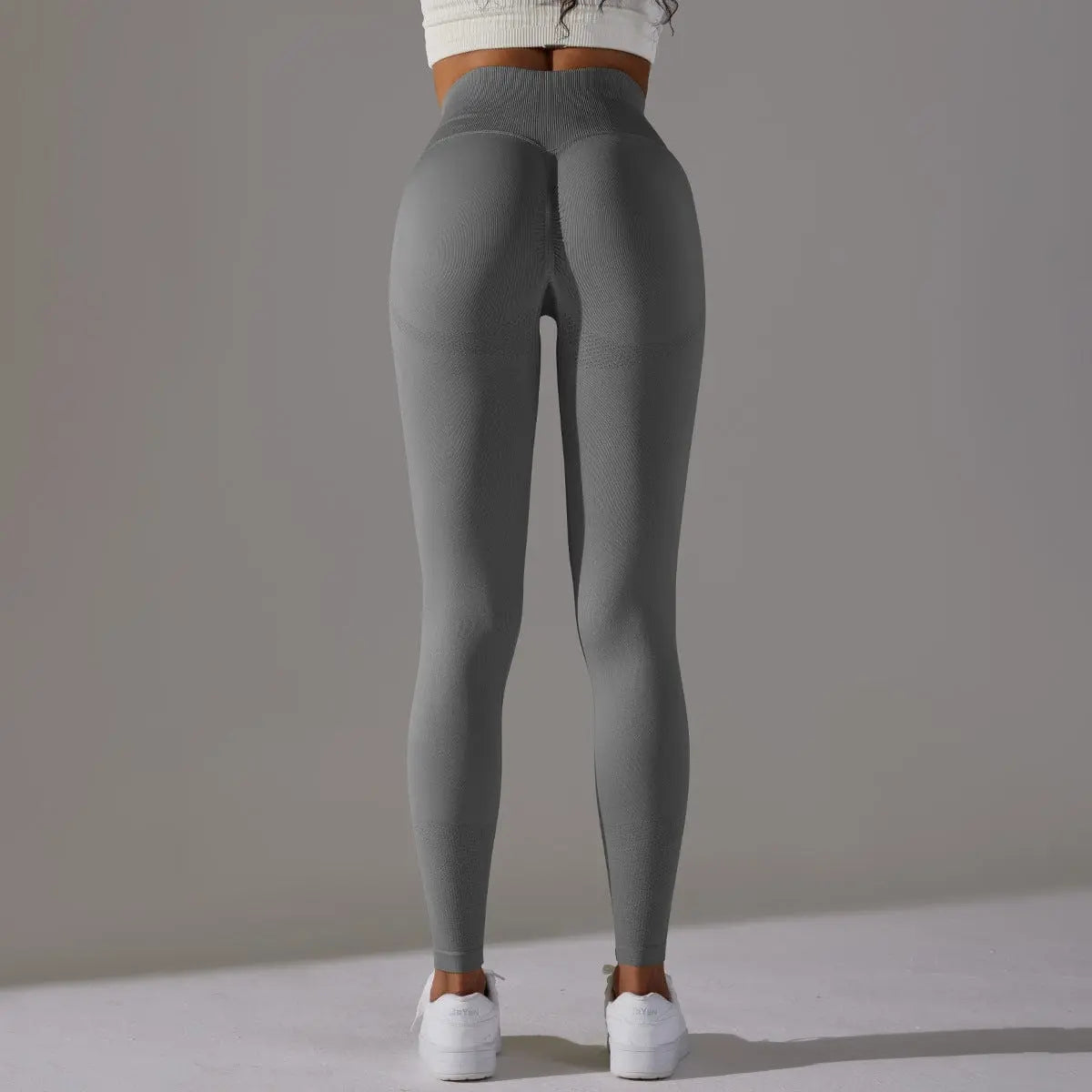Mannequin portant le legging de fitness, coupe ajustée et ceinture amincissante