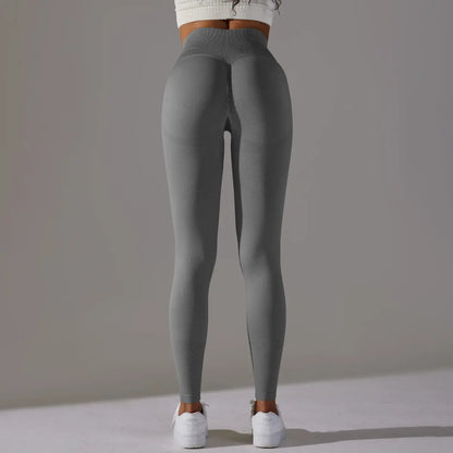 Mannequin portant le legging de fitness, coupe ajustée et ceinture amincissante