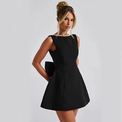 Robe courte noir  noeud dos elegante coupe evasee SecretBombe