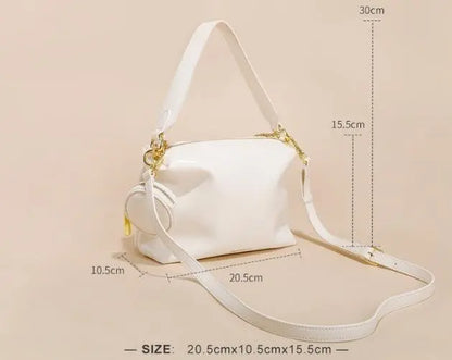 "Sac en cuir véritable beige, élégant et pratique pour la vie urbaine"