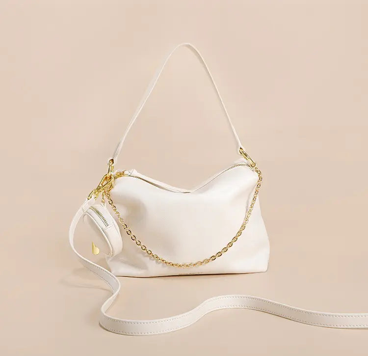 "Sac en cuir véritable beige, élégant et pratique pour la vie urbaine"