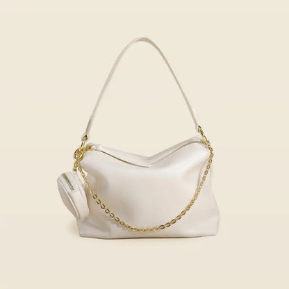 "Sac en cuir véritable beige, élégant et pratique pour la vie urbaine"