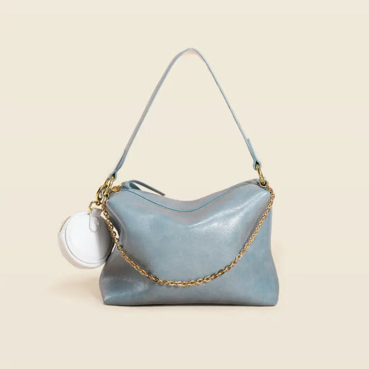 "Sac artisanal en cuir de vachette, doux au toucher et durable"