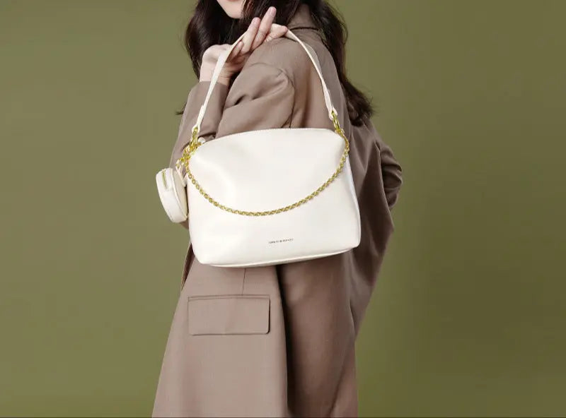"Sac en cuir véritable bleu, forme carrée avec pochette intérieure"