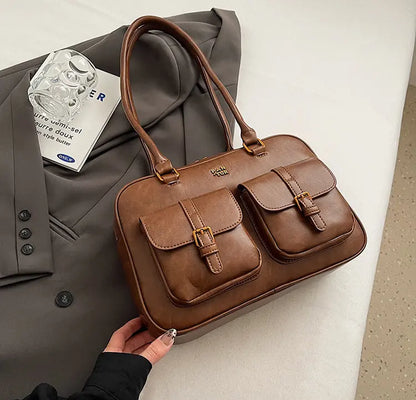 Sac à main marron chic avec coutures contrastées, vue de face.