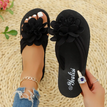 Tongs femme noires avec semelle souple et légère