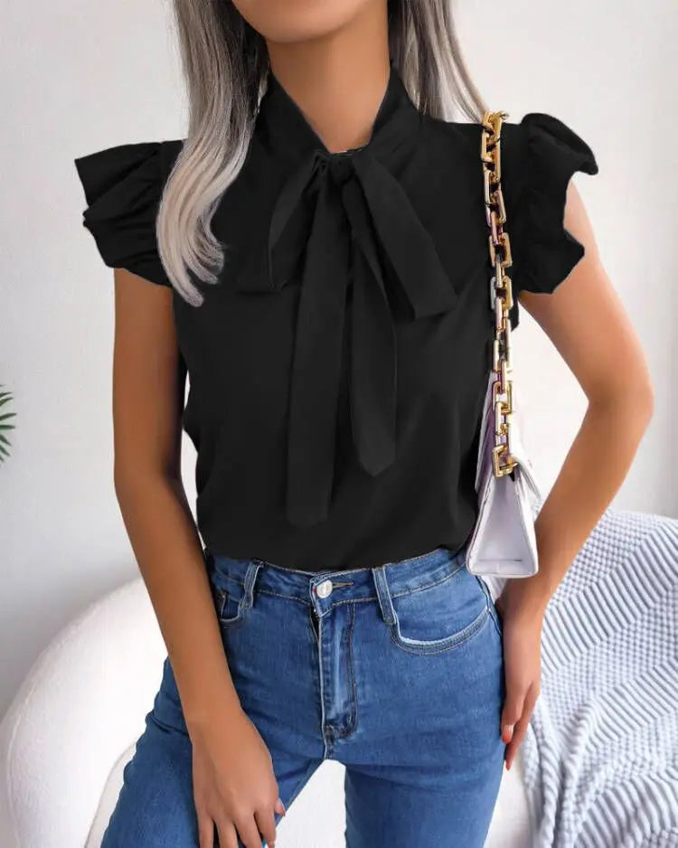 Blouse femme col nœud manches courtes bouffantes noir uni coupe slim style princesse tailles S à 2XL SecretBombe