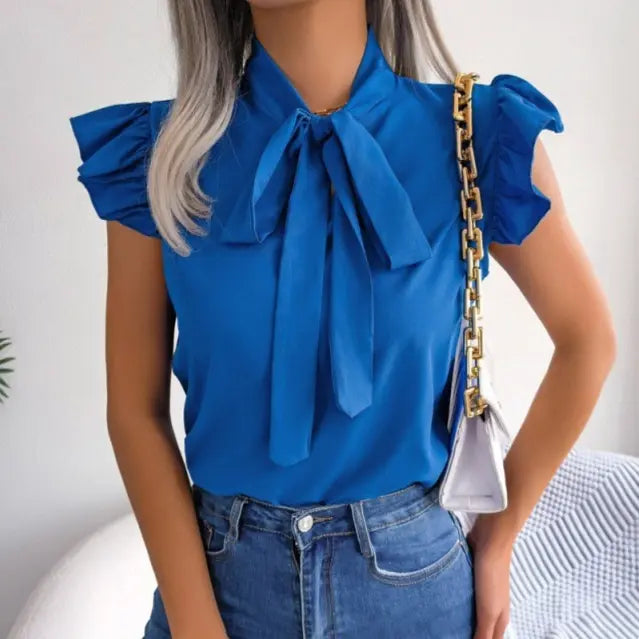 Chemisier bleu femme avec grand nœud lavallière et manches volantées SecretBombe