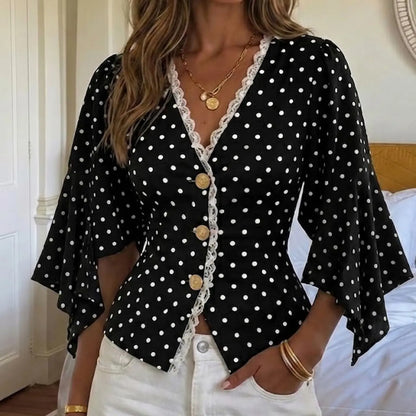 Blouse noire à pois blancs et manches à volants SecretBombe