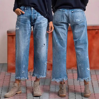 Jean droit femme en denim bleu avec trous et bas effiloché style street SecretBombe