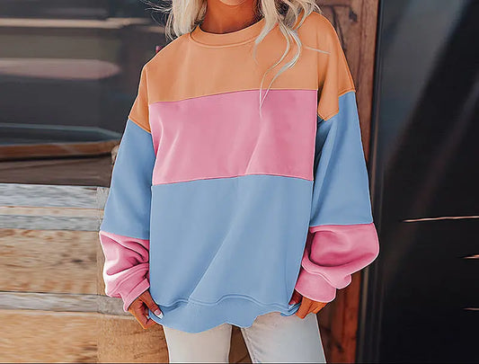 Sweat femme style streetwear, couleurs contrastées modernes, coupe oversize décontractée, look urbain tendance