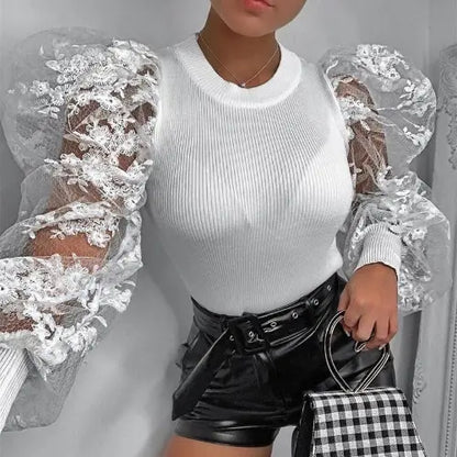 Top élégant femme pour soirée, manches bouffantes en dentelle florale, style chic et raffiné.