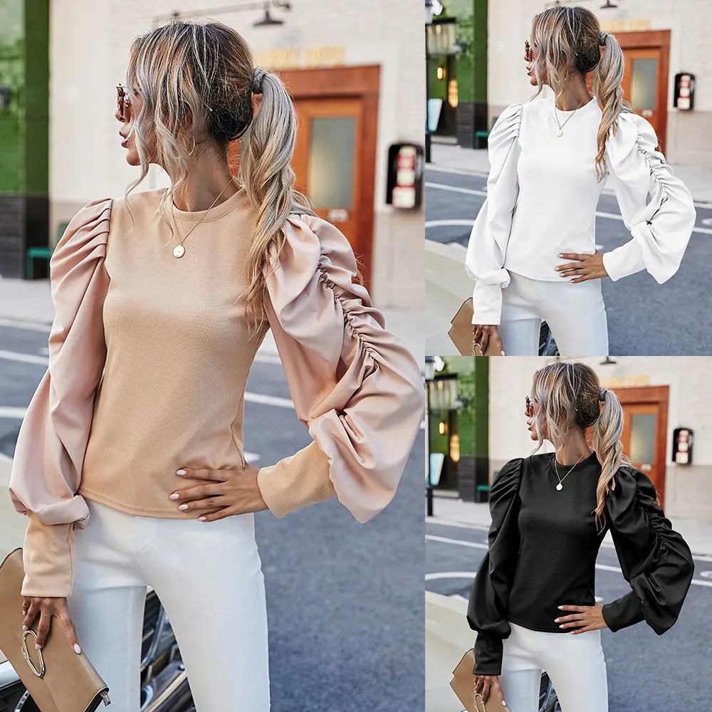 Top noir femme élégant et décontracté, manches longues sculptées bouffantes, style urban chic moderneHaut femme chic blanc, style urban chic, coupe ample tendance avec manches bouffantes et col rondTop femme urban chic taupe, coupe ample élégante avec manches longues bouffantes et encolure ras-du-cou