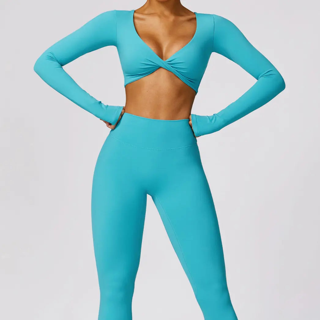 Top de sport bleu croisé en forme papillon, manches longues avec trous pour pouces